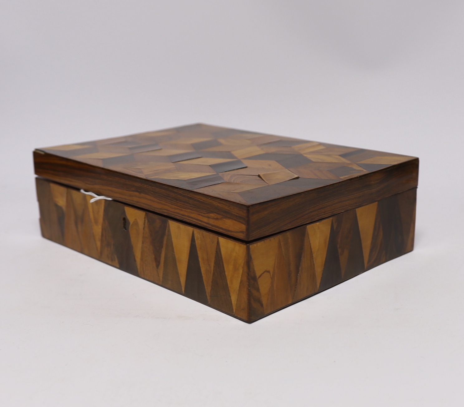 An early 19th century specimen wood perspective cube marquetry jewellery box, 27cm wide, 19.5cm deep, 8cm high